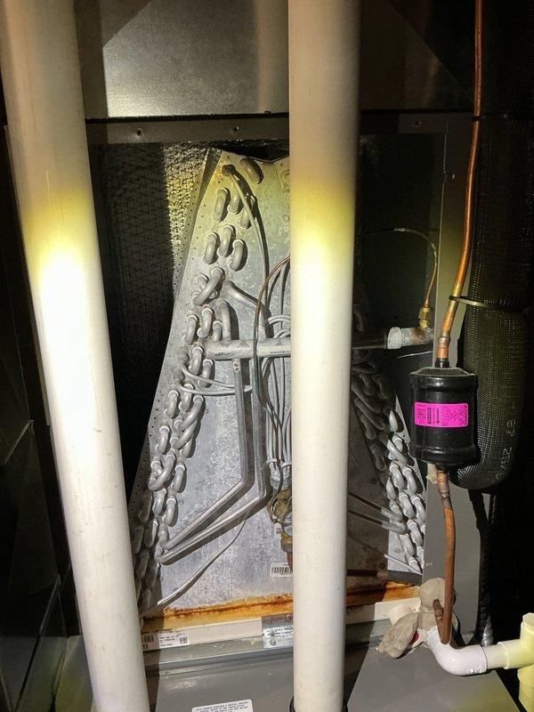 Completed annual HVAC maintenance inspection including filter evaluation and evaporator coil assessment. Filter showed visible debris accumulation and was documented; evaporator coil exhibited moisture condensation consistent with normal operation, with refrigerant lines and filter-drier component verified to be in proper working condition.