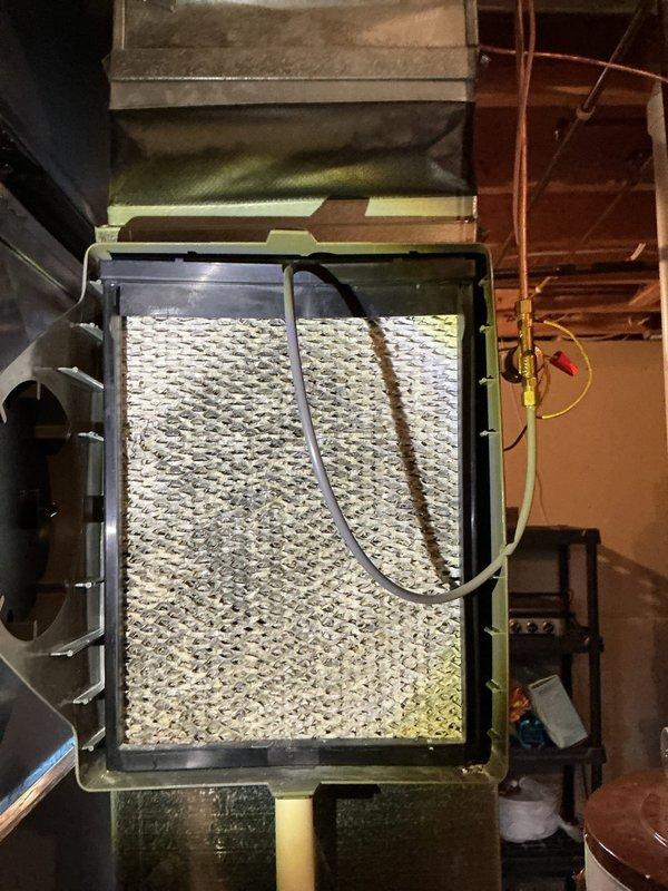 Completed comprehensive ComfortGuard Maintenance visit on residential HVAC system, performing standard inspection and maintenance procedures on furnace and air handler unit. Inspected air filtration system with mesh filter panel housed in metal ductwork frame, verified proper airflow through flexible duct connections, and examined blower motor assembly with associated wiring harnesses. All components found operating within normal parameters with no specialty service requirements identified during this recurring maintenance visit.