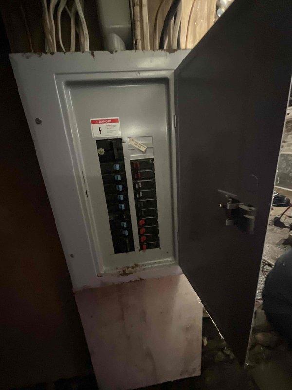 Conducted on-site assessment for replacement of 30-year-old residential furnace requiring ASAP replacement. Evaluated existing HVAC system, documented electrical panel configuration and utility room conditions, and photographed installation area including circuit breaker setup and basement workspace to prepare comprehensive equipment replacement estimate.