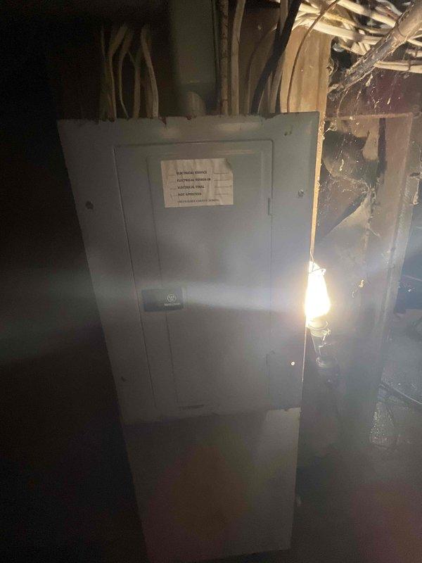 Conducted on-site assessment for replacement of 30-year-old residential furnace requiring ASAP replacement. Evaluated existing HVAC system, documented electrical panel configuration and utility room conditions, and photographed installation area including circuit breaker setup and basement workspace to prepare comprehensive equipment replacement estimate.