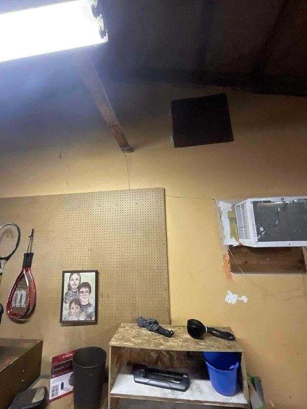 Conducted comprehensive site assessment for new mini split installation to replace existing boiler heating system. Evaluated garage/workshop area with window AC unit and attic space with exposed trusses and fiberglass insulation to determine optimal equipment placement and ductless system configuration. Provided customer with recommendations for converting current heating system to either forced air or mini split solution based on specific room requirements and existing structural conditions.