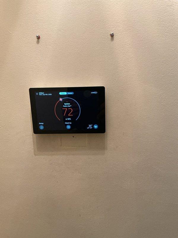 Responded to no-heat call on 2017 Monnex four-star furnace system. Upon arrival, found unit completely non-operational with suspected control board communication failure. Performed diagnostic testing on internal components, blower motor assembly, and electrical connections. Inspected thermostat programming and verified proper communication between wall-mounted digital thermostat set to 72°F and furnace control system. Documented furnace interior components and thermostat display for service records.