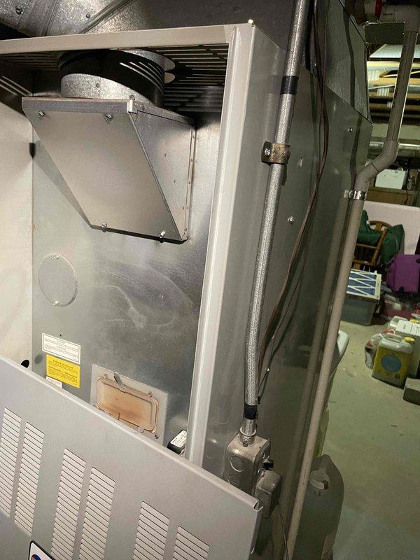 Conducted site assessment for replacement estimate of 30+ year old oil-fired furnace and air conditioning system located in basement. Evaluated existing HVAC equipment configuration including vertical air handler unit, evaporator coil assembly, and ductwork distribution system. Documented current system layout with exposed ductwork routing along ceiling joists and connection points to existing infrastructure. Prepared comprehensive replacement proposals for furnace and air conditioning equipment under promotional program, along with generator installation options featuring both Generac and Kohler models for comparison.