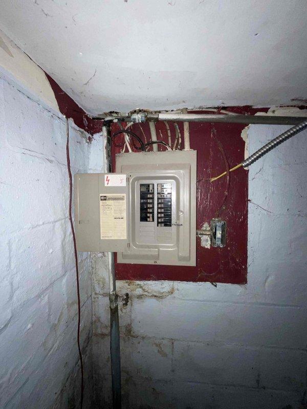 Conducted comprehensive assessment of basement HVAC system following flooding incident that rendered existing furnace inoperable. Evaluated gray metal furnace unit, associated ductwork, PVC venting system, and electrical panel to determine extent of water damage and replacement requirements. Documented current equipment configuration including metallic ductwork connections, condensate drainage lines, and electrical service panel condition showing signs of age and deterioration. Provided detailed replacement estimate for furnace and air conditioning system, including equipment specifications and installation scope for complete HVAC system upgrade.