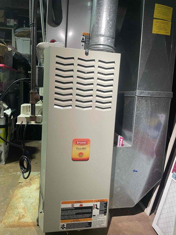 Completed HVAC estimate for air conditioning system replacement. Documented existing equipment including Bryant Plus 80v gas furnace and current AC system configuration with metallic ductwork and electrical connections. Provided replacement options and recommendations based on current installation setup in basement utility area.