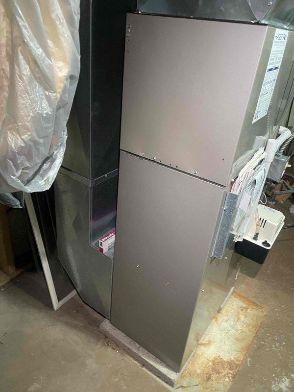 Completed HVAC estimate for air conditioning system replacement. Documented existing equipment including Bryant Plus 80v gas furnace and current AC system configuration with metallic ductwork and electrical connections. Provided replacement options and recommendations based on current installation setup in basement utility area.