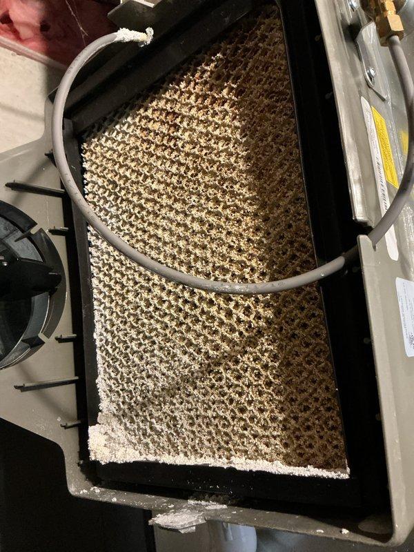 Completed annual cooling maintenance service on HVAC system. Inspected evaporator coil and air filter, which showed heavy accumulation of dust, dirt, and debris throughout the filter media requiring attention. Accessed mechanical space to inspect refrigerant lines, condensate drainage system, and associated piping components. Documented equipment condition with photos for service records. System operational upon completion of maintenance inspection.