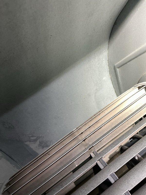 Responded to no-heat call for 4-year-old gas furnace and water heater both reported non-operational, with basement flooding present. Upon arrival, conducted diagnostic inspection of furnace system with cabinet access panel removed to assess internal components including heat exchanger, gas valve assembly, blower motor, and electrical connections. Verified all wire harnesses, safety controls, and mechanical components for proper operation. Inspected return air grille and ventilation system for adequate airflow. Documented system condition with interior cabinet photography showing gas valve, ignition components, heat exchanger assembly, and blower motor configuration. Basement flooding condition noted as potential contributing factor to equipment malfunction requiring water mitigation prior to full system restoration.
