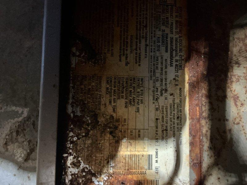 Responded to service call for furnace leaking water in basement location. Upon inspection, found extensive corrosion and rust on furnace cabinet and internal components, indicating prolonged moisture exposure. Identified water leakage issue originating from condensate drainage system. Inspected blower assembly, heat exchanger access area, and all visible ductwork connections for signs of active leaking and moisture accumulation. Documented heavily deteriorated condition of unit cabinet and internal metal surfaces with significant oxidation present. Verified electrical connections and wiring harnesses showed signs of age-related degradation with corrosion staining visible on lower cabinet panels. Advised customer of furnace condition and recommended replacement due to advanced age and extensive corrosion compromising unit integrity and safety.