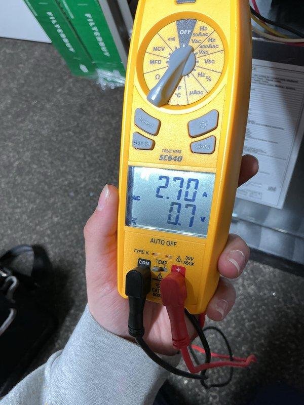 Completed routine preventive maintenance on a 2-year-old residential central air conditioning system. Performed comprehensive AC tune-up including inspection of outdoor condenser unit, electrical testing with multimeter showing 2.70 amp draw, verification of proper voltage levels, and assessment of overall system operation. Unit found to be functioning within normal parameters with no deficiencies noted. All components inspected and system confirmed operational.
