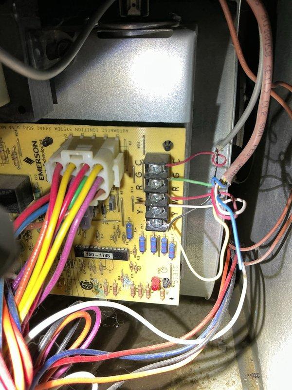 Responded to no-heat call on forced air furnace system affected by basement flooding. Performed thorough inspection of furnace components with focus on Emerson control board and electrical connections that were exposed to water. Documented water damage to control board assembly, wiring harnesses, and terminal connections through detailed photography. Advised that system requires complete cleaning and drying of all affected components before attempting restart to prevent electrical shorts or component failure. Recommended professional cleaning of control board, inspection of all wire connections for corrosion, and verification of proper system operation once dried to ensure safe restoration of heating capability.