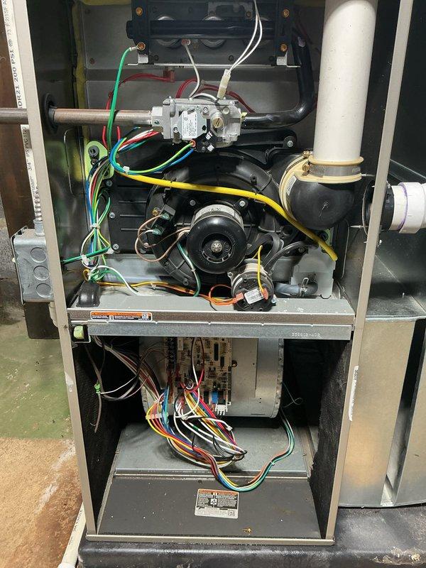 Responded to service call for post-flood inspection of 2019 Bryant furnace and water heater located in basement. Performed comprehensive diagnostic inspection of furnace internal components including gas valve assembly, burner chamber, electrical connections, control board, and PVC condensate drainage system. Inspected water heater and surrounding area, noting visible water damage on concrete floor from recent flooding. All mechanical and electrical components were examined for water intrusion, proper operation, and safety compliance following flood remediation.