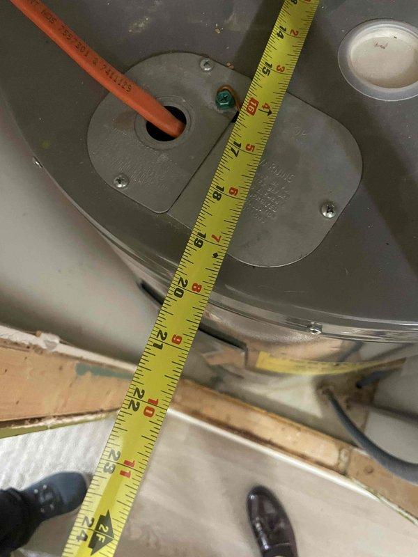 Completed on-site assessment of existing 40-gallon electric water heater (Model GEN40-2, manufactured August 2014) to provide replacement estimate and rent-to-own program information. Documented current unit specifications including 240V/4500W configuration, recorded dimensional measurements of installation space in attic location, and photographed equipment labels and access panels to determine replacement requirements and compatibility with existing plumbing and electrical connections.