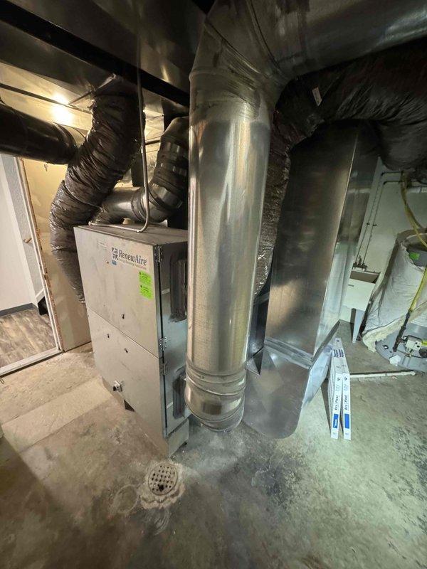 Completed scheduled commercial HVAC maintenance agreement service on multi-unit system including two gas furnaces, two air conditioning units, and one hot water tank. Performed comprehensive inspection of all equipment in basement mechanical room, checking operational status of furnace burners, heat exchangers, blowers, and electrical components. Inspected ductwork connections and flexible ducting for proper sealing and airflow. Verified thermostat calibration, tested safety controls, and confirmed proper venting. Examined air conditioning units for refrigerant levels, compressor operation, and condensate drainage. Inspected hot water tank for proper function and safety valve operation. All equipment found operating within manufacturer specifications with no immediate repairs required.