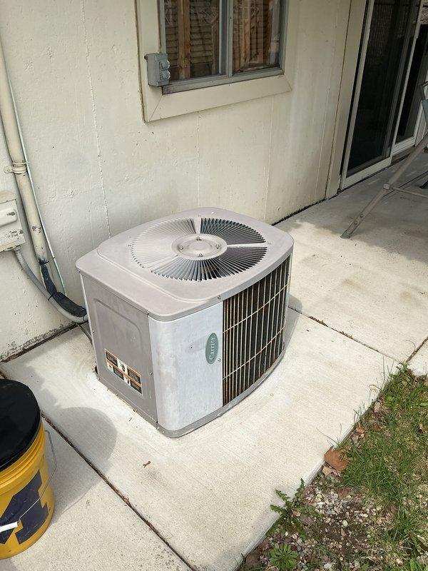 Completed annual cooling maintenance on residential split system air conditioning unit. Performed comprehensive inspection of outdoor condenser unit including visual examination of cabinet condition, fan operation, and refrigerant line connections. Verified electrical connections at disconnect and checked conduit routing. Inspected concrete pad for levelness and stability.

Addressed customer concern regarding hot water heater that was found in off position. Inspected Bradford White Defender Safety System water heater and associated components. Examined flue pipe configuration, copper supply lines, shut-off valves, and gas connections. Provided customer with assessment and recommendations for water heater operation. Unit photographed for documentation purposes.

Air conditioning system operating within normal parameters at time of inspection. All routine maintenance items completed per manufacturer specifications.