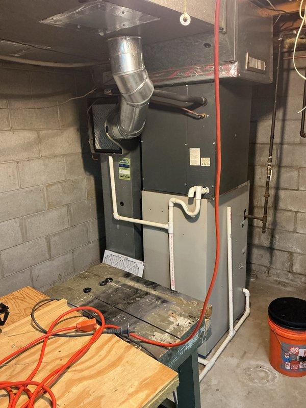 Performed routine air conditioning maintenance inspection on residential HVAC system. Upon inspection, identified dirty and clogged air filter with significant dust accumulation and discoloration affecting system airflow efficiency. Removed and replaced contaminated mesh filter with new unit to restore proper air circulation and system performance. Completed standard ACM protocol including visual inspection of furnace unit, ductwork connections, and associated components. System operational and running efficiently following filter replacement.