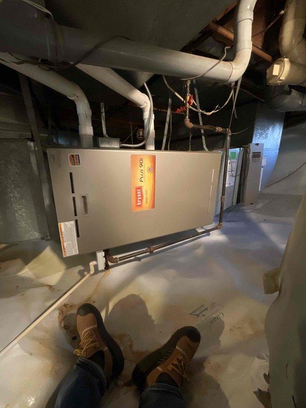 Responded to service call for 21-year-old Bryant furnace in basement displaying error codes 13 and 33 with no heat condition. Assessed existing heating system and provided replacement estimate for furnace unit. Equipment located in basement mechanical room with existing PVC venting infrastructure and ductwork in place.