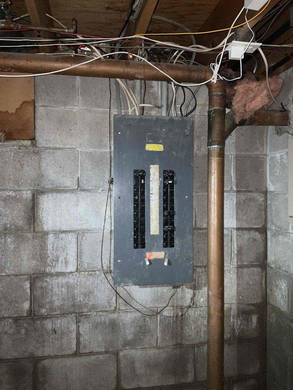 Provided comprehensive estimate for replacement of non-functional furnace and hot water heater located in basement utility area, with equipment aged 10-15 years. Assessment included evaluation of existing electrical panel, corroded plumbing infrastructure, and air handler system showing significant dust accumulation and wear. Additional estimate prepared for possible air conditioning system replacement to complete full HVAC upgrade.