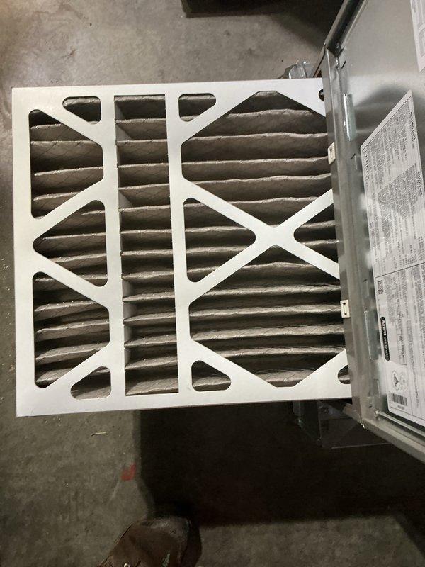 Completed comprehensive HVAC maintenance inspection on air handler and furnace unit. Inspected air filter showing normal dust accumulation on pleated media, verified proper installation within housing. Examined internal furnace components including gas valve assembly with electronic controls, blower motor assembly, and all associated wiring connections. Verified proper operation of safety controls, condensate drain lines, and electrical connections. All components found operating within normal parameters with no issues requiring immediate attention.