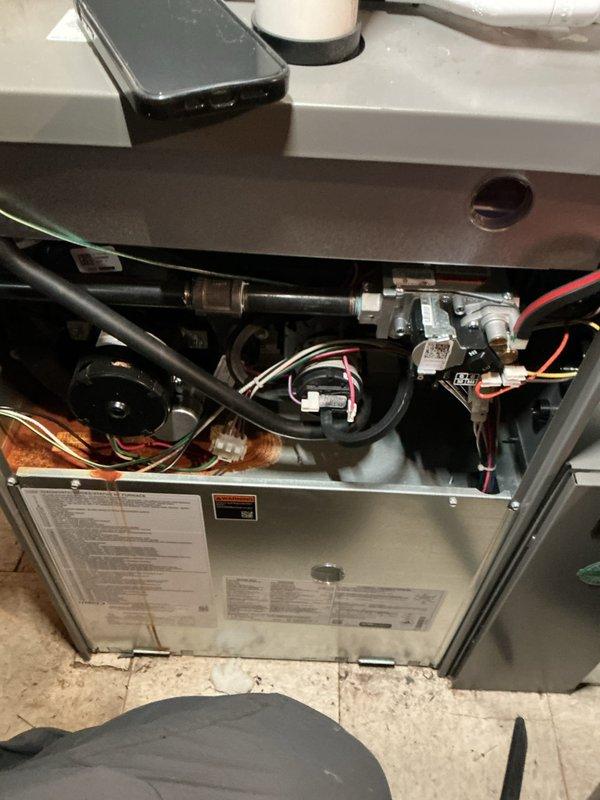 Completed scheduled ComfortGuard preventive maintenance visit on residential HVAC system. Performed comprehensive inspection of furnace unit, including examination of gas valve assembly, ignition components, heat exchanger, and all electrical connections. Cleaned burner assembly and internal components to ensure optimal system performance and efficiency for continued reliable operation.