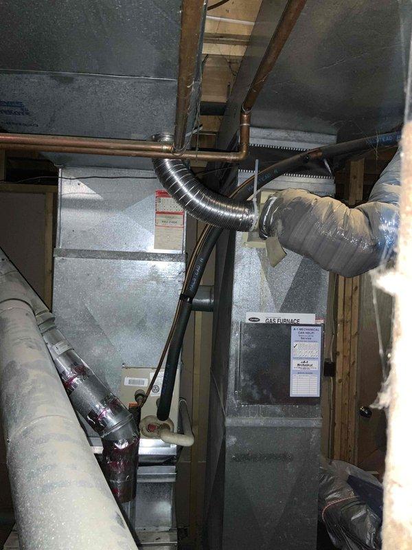 Conducted on-site assessment of a 40-year-old non-operational gas furnace and air conditioning system located in the basement for replacement estimate. Documented existing HVAC equipment configuration, including deteriorated ductwork connections, aged refrigerant lines, and outdated furnace unit in unfinished utility space with exposed framing. Provided comprehensive replacement quote for new furnace and air conditioning system under promotional program.