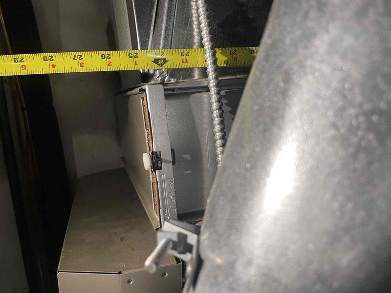 Responded to service call for 17-year-old furnace experiencing short cycling issues where unit was attempting to ignite but shutting down immediately after startup. Performed on-site assessment and took clearance measurements of existing HVAC equipment and surrounding ductwork to determine specifications for replacement unit. Provided estimate for complete furnace replacement system to resolve the operational failure and restore heating functionality to the residence.