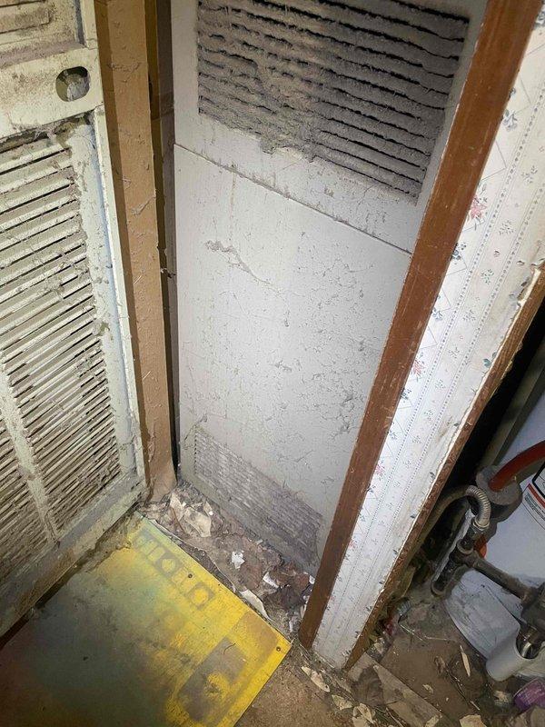 Conducted comprehensive full system estimate for aged residential property currently equipped with furnace only and no existing air conditioning. Evaluated existing electrical panel capacity and circuit availability to support new HVAC system installation, documenting current breaker configuration and available amperage for equipment requirements. Assessed mechanical space containing aged HVAC equipment, noting accumulated debris and deteriorated conditions in utility area that will require preparation for new system installation. Provided estimate for complete heating and cooling system replacement to add air conditioning capability to residence within current season timeframe.