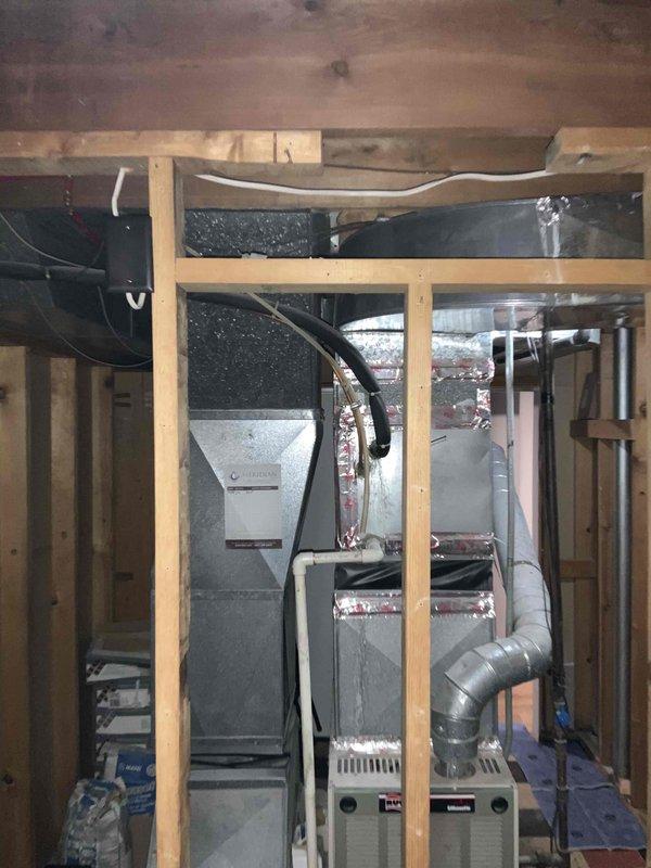Conducted comprehensive assessment of existing 16-year-old HVAC system including furnace and air conditioning unit to provide full system replacement estimate. Evaluated current equipment configuration, ductwork condition, and installation requirements in unfinished basement mechanical room, documenting existing Trane furnace setup and associated air handling components. Provided detailed replacement recommendations for aging heating and cooling equipment along with water heater options to address homeowner's request for complete system upgrade within current season.