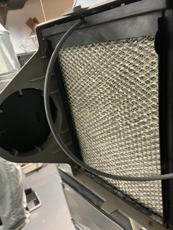 Completed annual cooling maintenance on residential HVAC system. Performed routine inspection of furnace and air handling components in basement mechanical room. Replaced humidifier filter pad and HVAC air filter per maintenance schedule. Verified proper operation of all system components and controls. Unit operating within normal parameters upon completion of service.