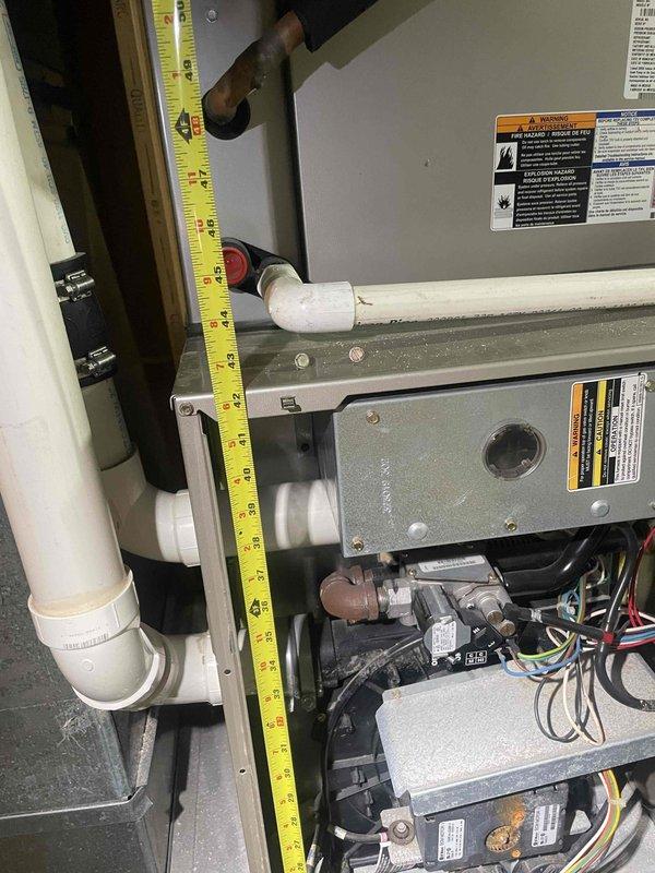 Responded to no-heat call caused by flood damage to existing HVAC system. Performed on-site assessment and measurements of current furnace installation, evaluating equipment dimensions, clearances, and existing ductwork connections in confined space. Provided estimate for complete furnace and air conditioning system replacement due to flood-damaged equipment being non-operational.