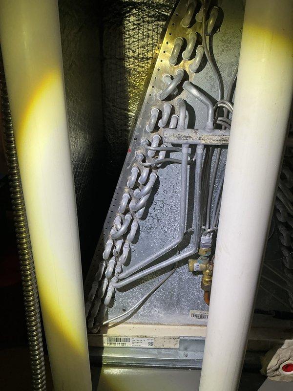 Completed annual cooling maintenance on HVAC system. Inspected internal components including refrigerant lines, compressor connections, and electrical wiring. Removed accumulated debris from condensing unit base and verified all mechanical components operating within normal parameters.