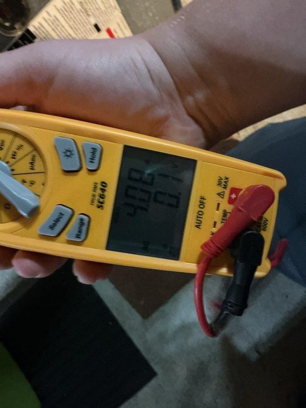Completed annual cooling maintenance on air conditioning system. Replaced air filter and evaporator pad, performed electrical diagnostics using digital clamp meter with readings indicating normal operating parameters at 45.48 units, and documented system condition through photographic records.