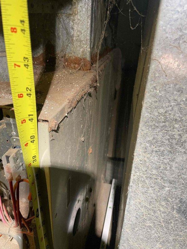 Provided comprehensive estimate for complete furnace and air conditioning system replacement in basement location. Current 30-year-old equipment remains operational but has reached end of serviceable life, showing significant wear, dust accumulation, and deterioration of surrounding components. Performed detailed measurements and photographic documentation of existing installation space and equipment dimensions to ensure proper sizing and fitment of replacement systems.