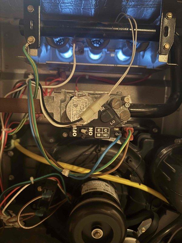 Responded to callback for heating system not reaching set temperature in basement location. Upon inspection, verified burner assembly operation with proper blue flame combustion pattern across all three burner ports. Examined gas valve control unit and confirmed all electrical connections secure, including thermostat wiring and safety circuits. Inspected blower motor assembly and associated wire harnesses for proper operation. System tested and found operating within normal parameters with no deficiencies noted at time of service.