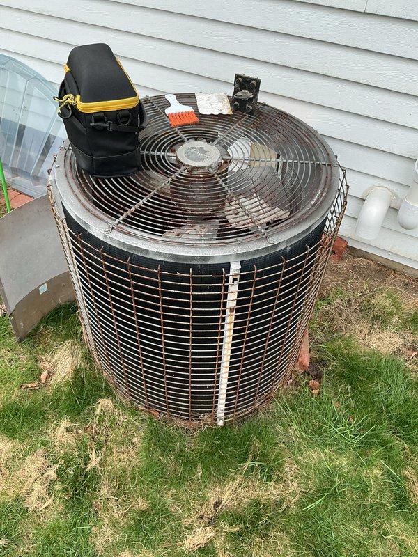 Completed annual cooling maintenance on outdoor condensing unit. Performed system diagnostics using digital multimeter to verify electrical readings and component operation. Inspected condenser coil and exterior components, noting age-related weathering and surface corrosion on metal surfaces. Cleaned accessible areas and checked refrigerant pressures. All system parameters operating within acceptable range at time of service completion.