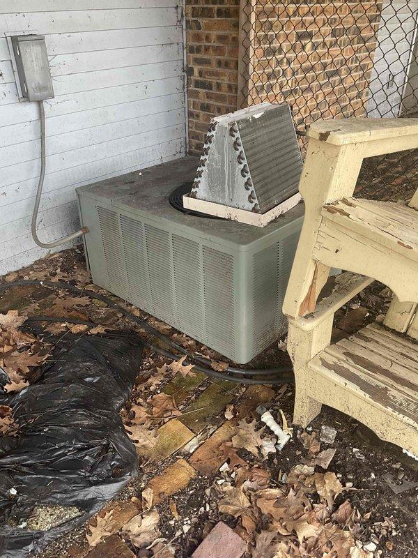 Conducted full system estimate for residential HVAC replacement. Evaluated existing 16-year-old air conditioning unit positioned on exterior pad with significant debris accumulation and deteriorated mounting surface. Unit features top-mounted A-frame condenser coil configuration showing signs of weathering and outdoor exposure. Customer recently had furnace installation completed and is seeking air conditioning replacement within the next couple weeks to complete full system upgrade. Assessed installation site conditions, equipment access, electrical service routing, and clearance requirements. Documented current equipment specifications and surrounding area conditions including compromised pad surface and accumulated organic debris requiring attention during replacement. Provided comprehensive estimate for new air conditioning system installation to match recently installed furnace and restore complete climate control functionality.