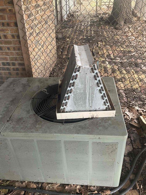 Conducted full system estimate for residential HVAC replacement. Evaluated existing 16-year-old air conditioning unit positioned on exterior pad with significant debris accumulation and deteriorated mounting surface. Unit features top-mounted A-frame condenser coil configuration showing signs of weathering and outdoor exposure. Customer recently had furnace installation completed and is seeking air conditioning replacement within the next couple weeks to complete full system upgrade. Assessed installation site conditions, equipment access, electrical service routing, and clearance requirements. Documented current equipment specifications and surrounding area conditions including compromised pad surface and accumulated organic debris requiring attention during replacement. Provided comprehensive estimate for new air conditioning system installation to match recently installed furnace and restore complete climate control functionality.