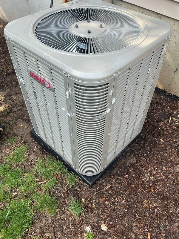 Completed annual cooling maintenance on two Lennox outdoor condenser units. Performed comprehensive inspection of both systems, documenting equipment condition with photographs showing units properly positioned on isolation pads with adequate clearance. Verified refrigerant lines, electrical disconnects, and exterior cabinet conditions were satisfactory with no visible damage or deterioration noted on either unit.