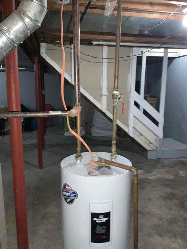 Conducted site assessment for new air conditioning system installation in residential property with no existing A/C equipment. Evaluated basement utility area to determine optimal placement and configuration for new system components, reviewing existing ductwork infrastructure, available space near water heater and support columns, and electrical service capacity. Documented current HVAC setup including furnace unit and supply duct layout to provide accurate equipment sizing recommendations and installation estimate.