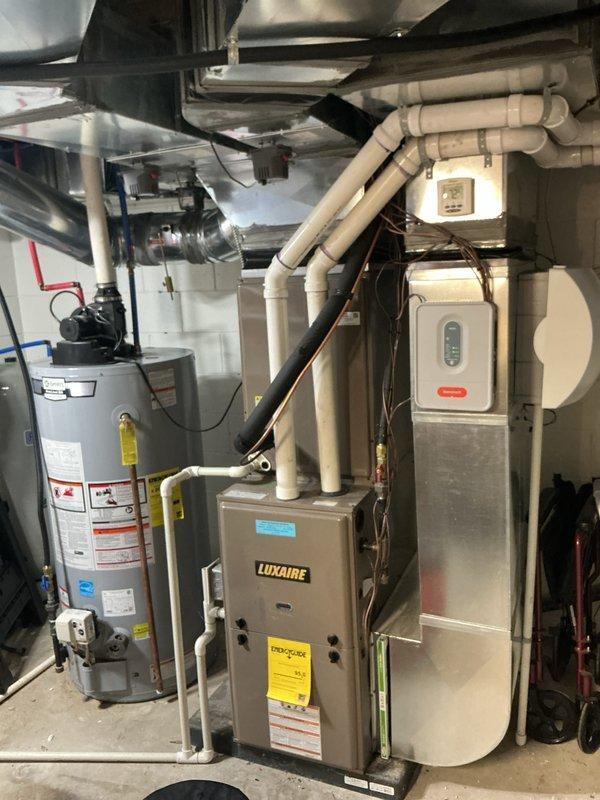 Completed comprehensive Air Care Heating and Cooling maintenance on Luxaire furnace system. Performed thorough inspection of all heating components including gas valve assembly, blower motor, control board, and electrical connections. Verified proper operation of draft inducer, inspected heat exchanger, and confirmed all safety controls functioning correctly. Checked and tested blower motor assembly and verified proper airflow. Inspected all wiring connections, control board operation, and safety interlocks. Examined water heater connections and associated plumbing in mechanical room. All equipment operating within manufacturer specifications with no deficiencies noted. System ready for continued reliable operation.