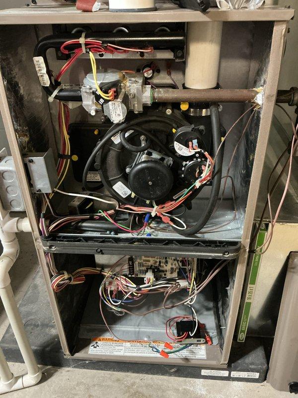 Completed comprehensive Air Care Heating and Cooling maintenance on Luxaire furnace system. Performed thorough inspection of all heating components including gas valve assembly, blower motor, control board, and electrical connections. Verified proper operation of draft inducer, inspected heat exchanger, and confirmed all safety controls functioning correctly. Checked and tested blower motor assembly and verified proper airflow. Inspected all wiring connections, control board operation, and safety interlocks. Examined water heater connections and associated plumbing in mechanical room. All equipment operating within manufacturer specifications with no deficiencies noted. System ready for continued reliable operation.