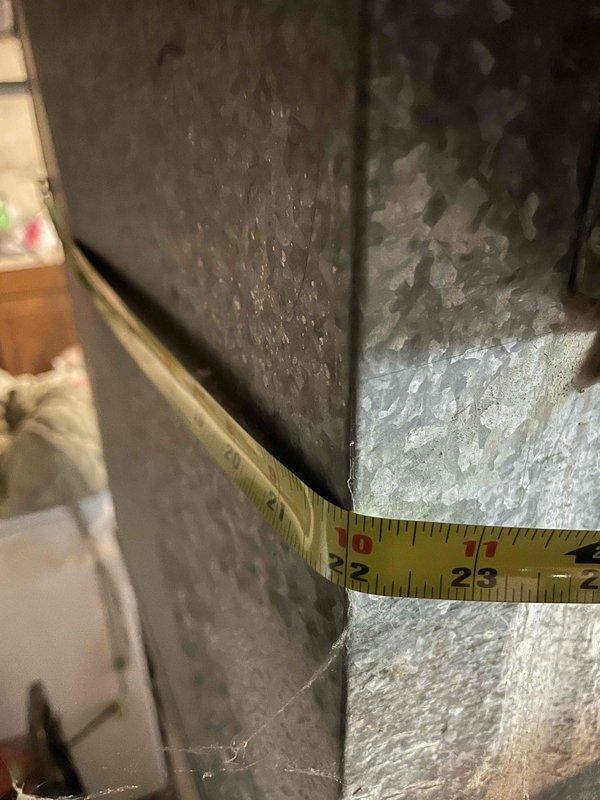 Conducted comprehensive evaluation of existing Amana furnace system and ductwork installation in basement utility area. Previous technician had identified discontinued components requiring replacement, prompting full system assessment. Performed detailed measurements of current ductwork dimensions and documented existing HVAC infrastructure including metallic supply ducts, flexible connections, and air distribution configuration. Evaluated furnace condition, examined ductwork routing with elbow joints and horizontal runs, and assessed overall system layout for replacement planning. Provided complete estimate for new full system installation to address obsolete components and ensure proper heating functionality for upcoming season.