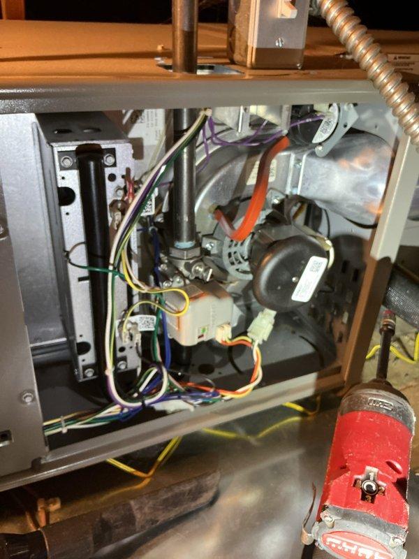 Completed routine maintenance and tune-up on attic-mounted central air conditioning system with Healthy Climate air quality component. Accessed unit via ladder, performed comprehensive inspection of blower motor assembly, electrical connections, and all mechanical components. Verified proper operation of dual motor system, checked all wiring connections including control circuits, inspected ductwork connections, and confirmed system is functioning within normal parameters with no deficiencies noted.