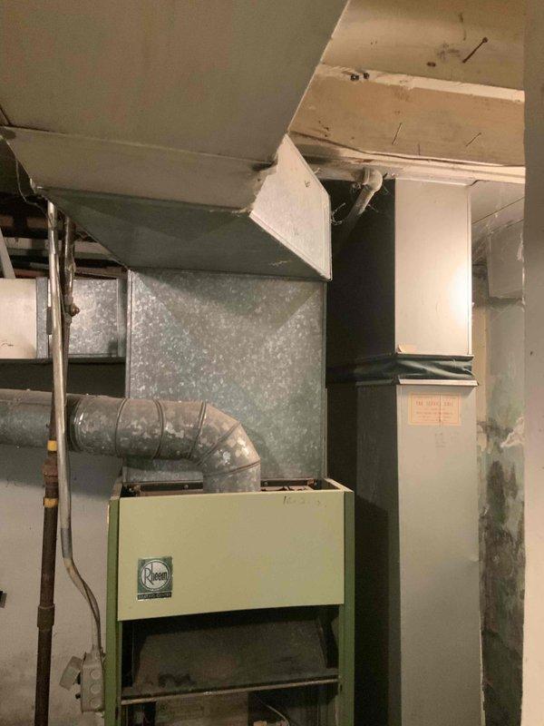 Completed on-site assessment and provided comprehensive replacement estimate for severely aged HVAC system at residential property. Evaluated existing 70-year-old gas furnace showing significant deterioration, dust accumulation, and outdated burner assembly with exposed internal components. Documented air conditioning unit requiring replacement due to age and inefficiency. Assessed basement mechanical room conditions including damaged ceiling panels, aging ductwork, and structural concerns affecting equipment installation accessibility. Provided detailed quote for complete HVAC system replacement including new furnace, air conditioner, and necessary ductwork modifications. Additionally evaluated existing fuse box electrical service and prepared estimate for upgrade to modern breaker panel to support new HVAC equipment electrical requirements and improve overall system safety and code compliance.