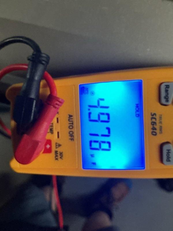 Completed annual HVAC maintenance inspection and testing. Performed electrical diagnostics using digital multimeter, verifying system voltage at 125V AC and measuring additional parameters at 497.8V, confirming proper electrical operation and system functionality.
