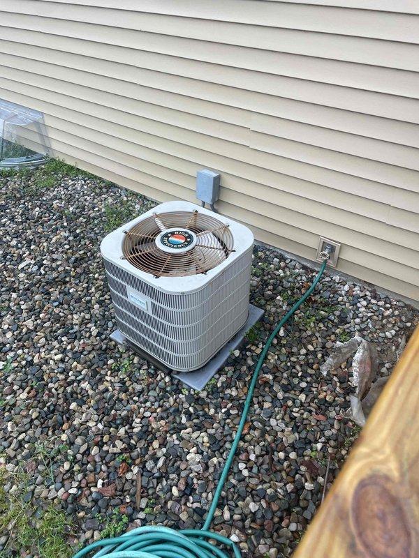 Provided comprehensive estimate for full HVAC system replacement on residential property with 25-year-old air conditioning unit experiencing cooling failure. Outdoor condenser unit operational but not producing cooling despite airflow from vents. Assessed existing equipment including outdoor AC unit on concrete pad with proper drainage, electrical service panel with multiple circuit breakers, and refrigerant line routing. Documented current system configuration and electrical infrastructure to develop replacement specifications for both furnace and air conditioning components.