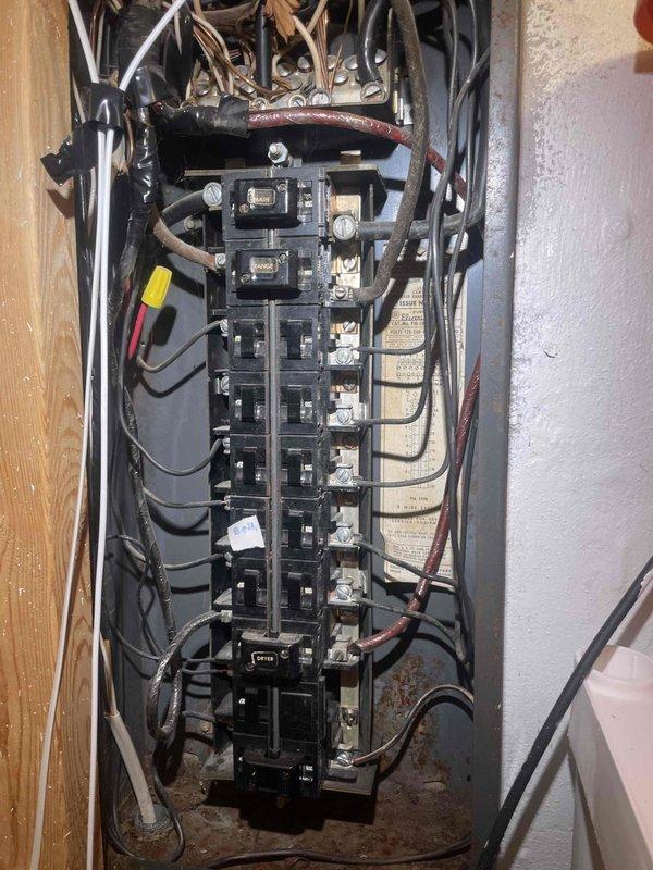 Provided comprehensive estimate for full HVAC system replacement on residential property with 25-year-old air conditioning unit experiencing cooling failure. Outdoor condenser unit operational but not producing cooling despite airflow from vents. Assessed existing equipment including outdoor AC unit on concrete pad with proper drainage, electrical service panel with multiple circuit breakers, and refrigerant line routing. Documented current system configuration and electrical infrastructure to develop replacement specifications for both furnace and air conditioning components.