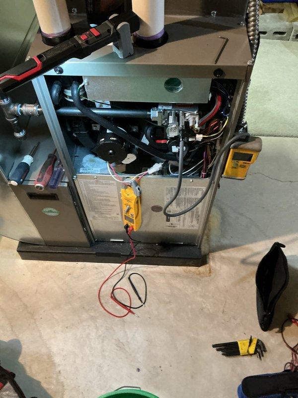 Completed comprehensive Air Care Heating and Air Care Cooling recurring maintenance service on residential HVAC system. Performed thorough inspection of furnace unit with access panel removed, tested electrical components using digital multimeter, verified proper operation of blower assembly, inspected wiring harnesses and connections, checked PVC venting and condensate drain lines for proper function, and examined air filter condition. All system components found operating within manufacturer specifications and unit returned to normal service.