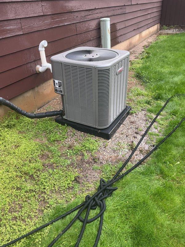 Completed comprehensive tune-up on 5-year-old Lennox air conditioning condenser unit located on exterior pad with proper clearances. Performed full system inspection including refrigerant level check, electrical connections, capacitor testing, contactor evaluation, and condenser coil cleaning. Unit operating within normal parameters with no deficiencies noted; all components functioning properly and system ready for cooling season.