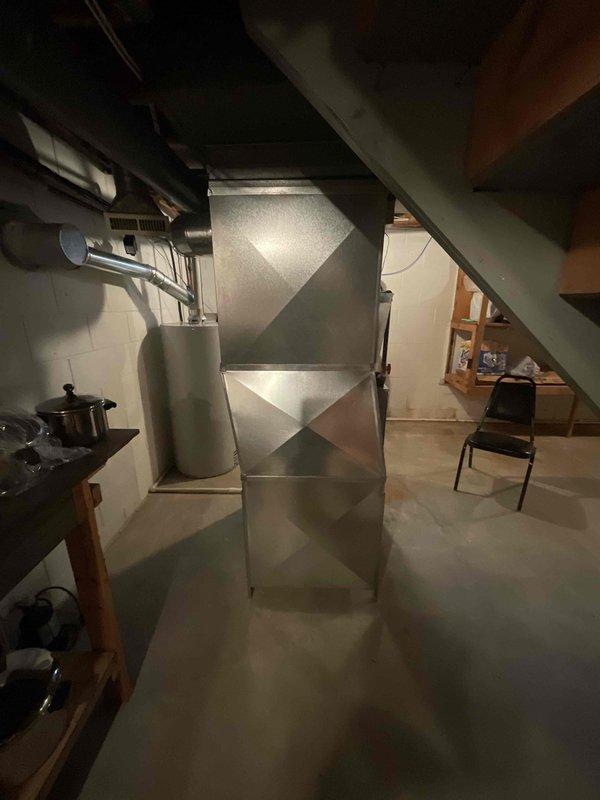 Conducted HVAC equipment replacement estimate for furnace and air conditioning system in basement location. Customer reported system not reaching set temperature. Reviewed existing equipment installation, including main trunk ductwork and air distribution system. Assessed current galvanized metal ductwork configuration and HVAC infrastructure to determine replacement requirements. Provided comprehensive estimate for complete furnace and A/C system replacement to address heating and cooling deficiencies.